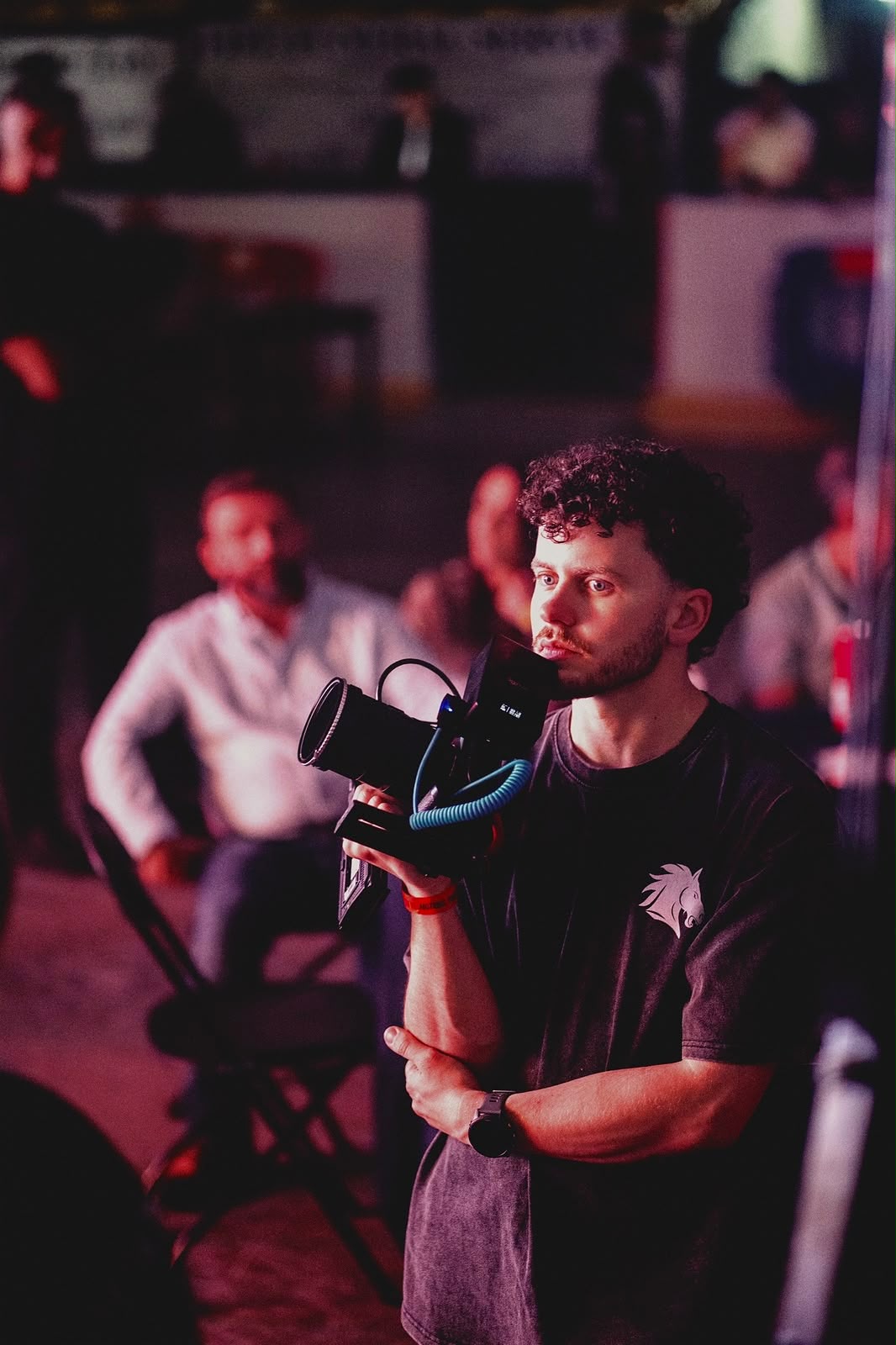 Calum filming on set with a cinema camera