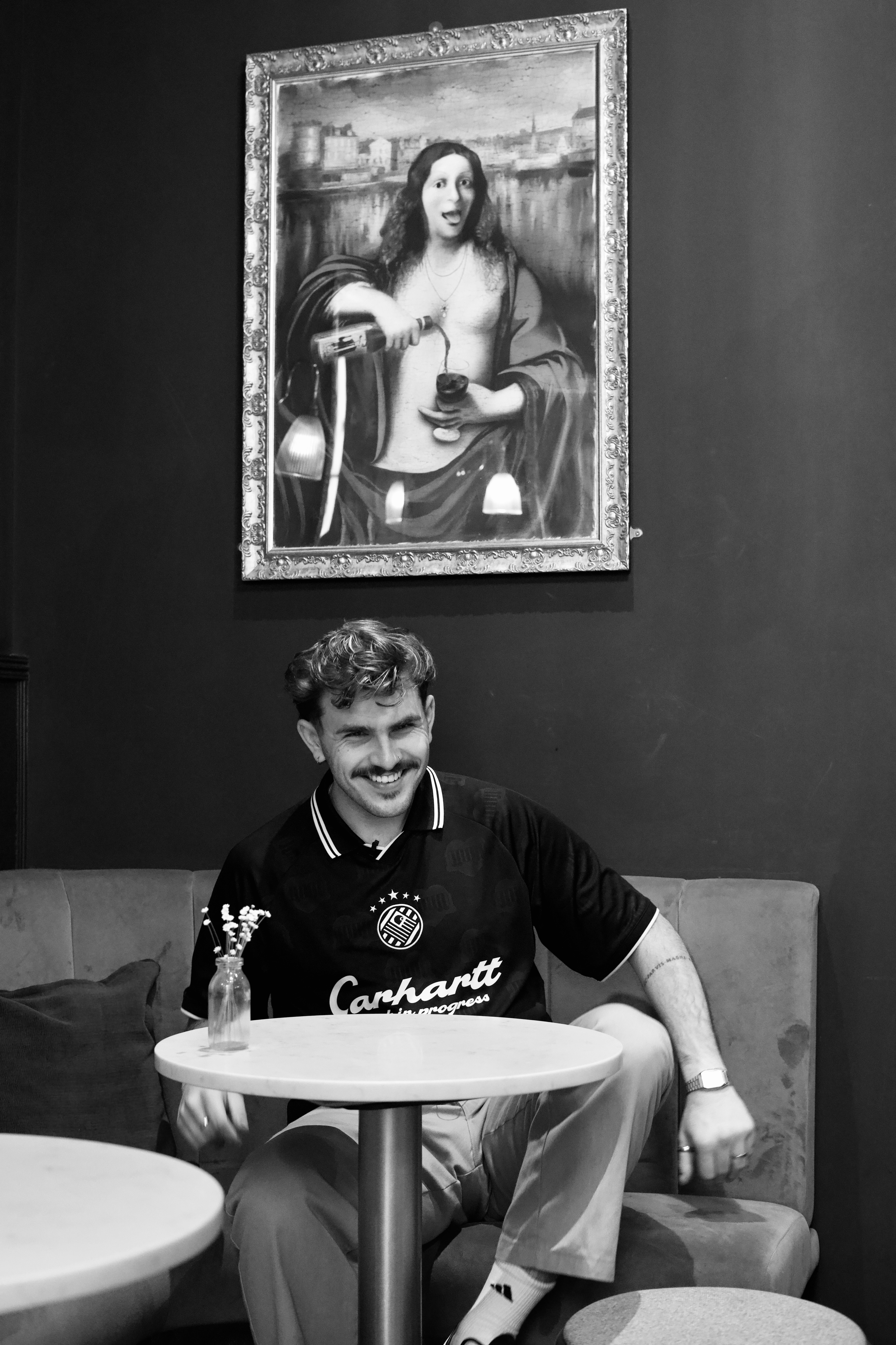 Keir smiling at a cafe table