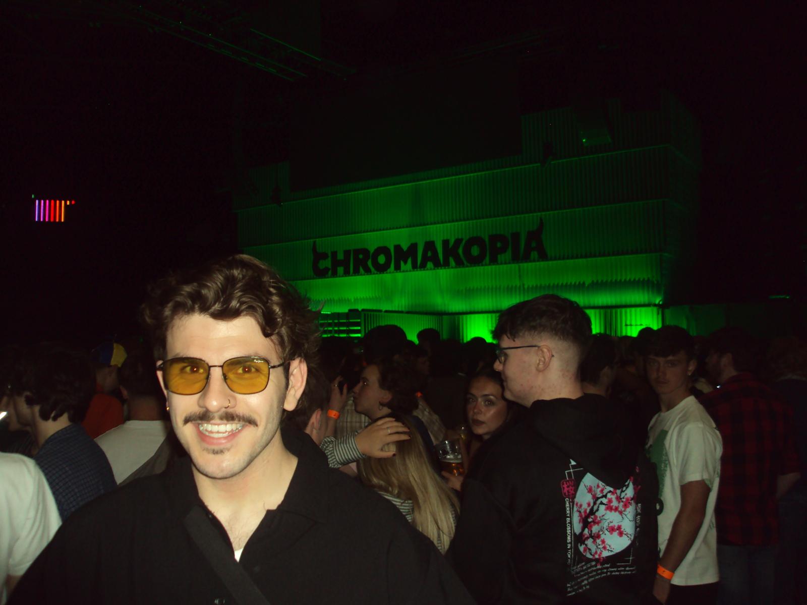 Keir at a concert with the Chromakopia stage behind him