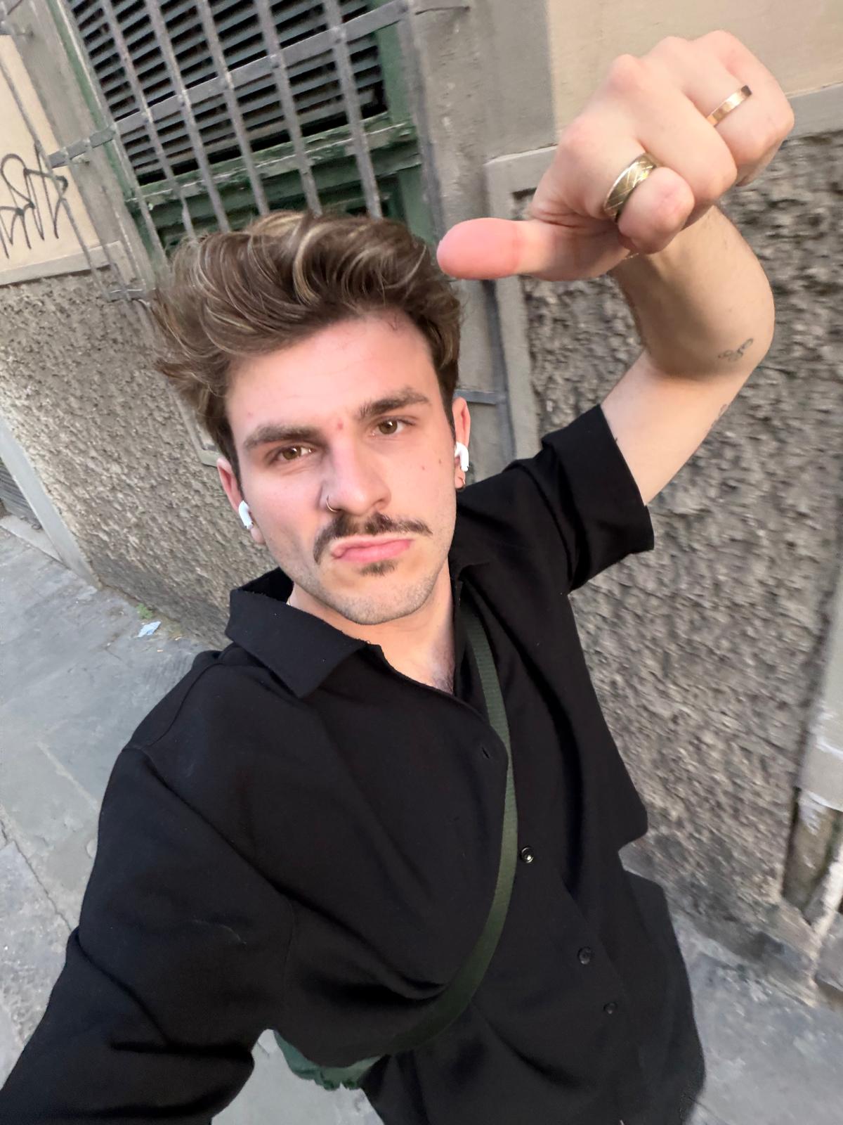 Keir taking a selfie on a city street